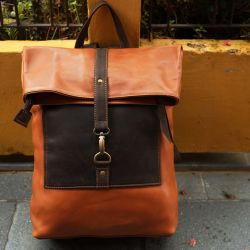 Hoi An Real Leather - Da Bao Real Leather: Multicolor Messenger Backpack. Light brown with dark brown decoration, made of buffalo leather. Closing with a metal buckle and a zipper.