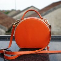 Hoi An Real Leather - Da Bao Real Leather: Leather Bags - Orange drum bag for ladies. Photo taken from balcony of our Hoi An leather shop.
